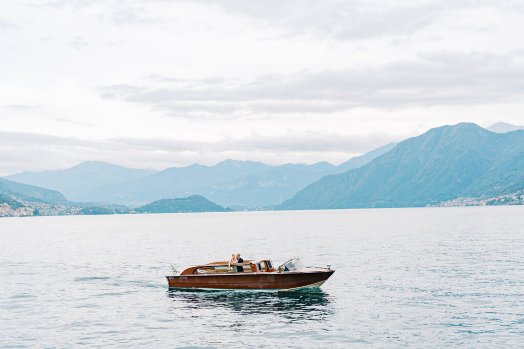 Wedding couple on a brown luxury boat in Lake Como.