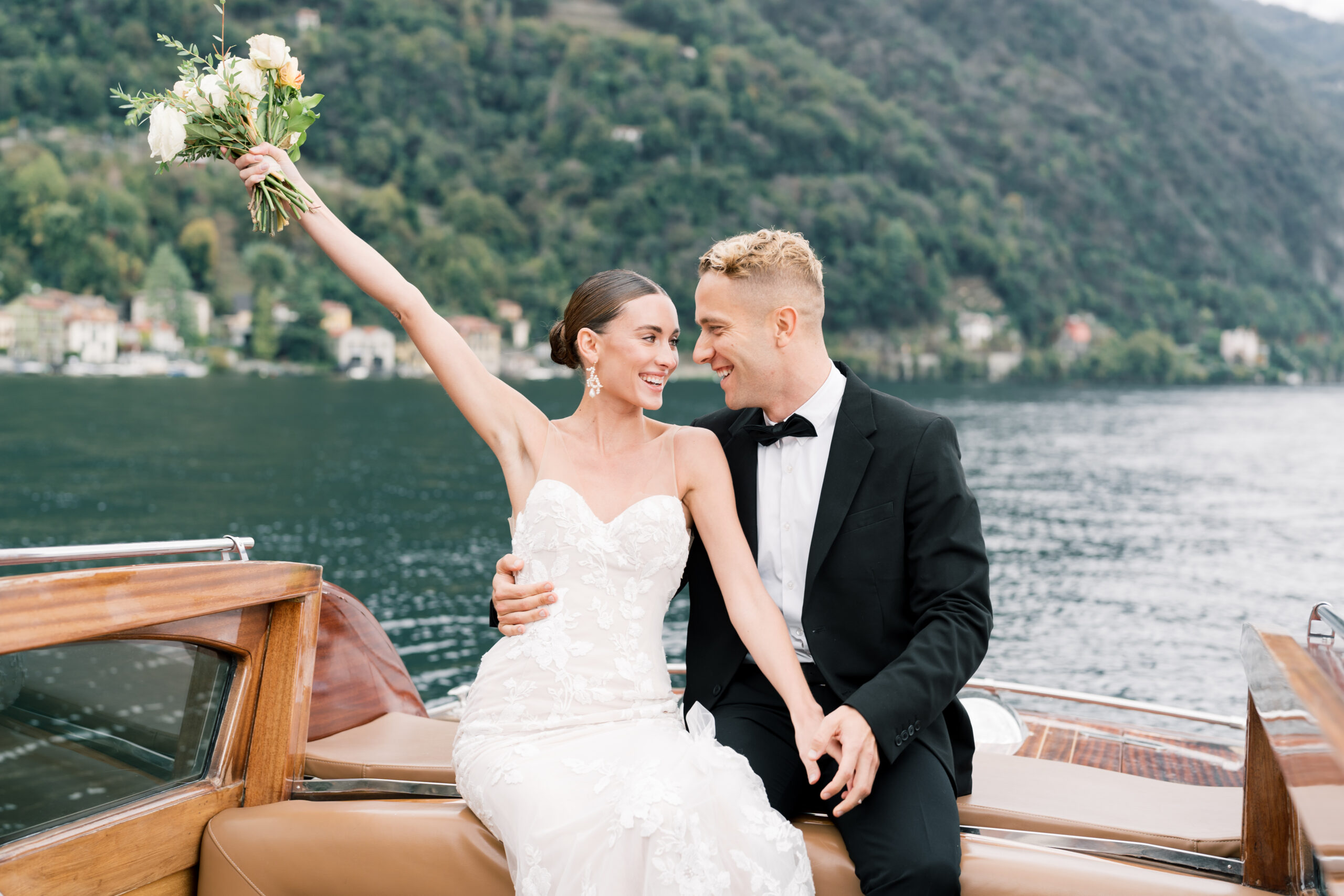 wedding couple celebrating in a luxury Italian boat.
